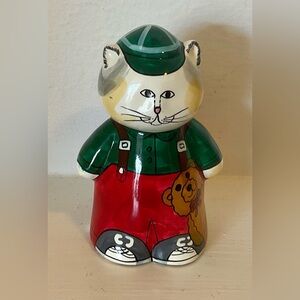 Vintage 1982 Enesco Susan Marie McChesney cat wearing green teddy bear hat.